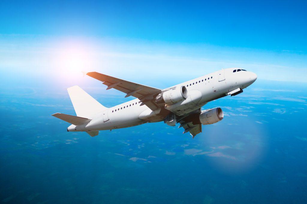 Airplane,In,The,Flight,,Travel,Background,With,Airplane,Flying,In